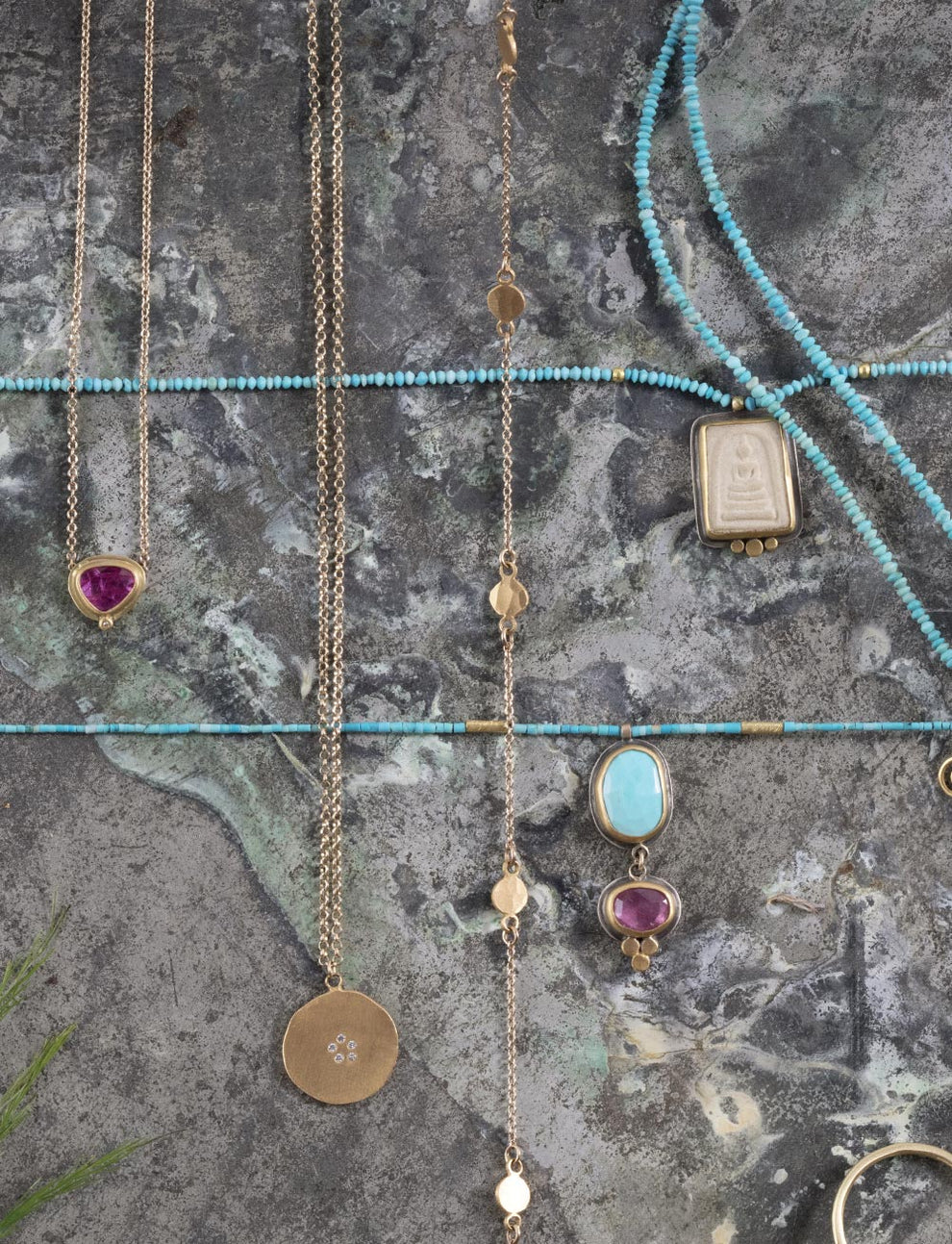 turquoise and gold handmade jewelry, grey background