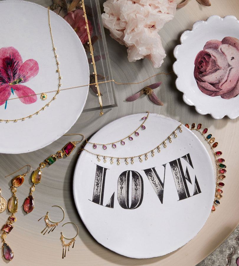A beautifully arranged display of romantic-themed jewelry and decorative items