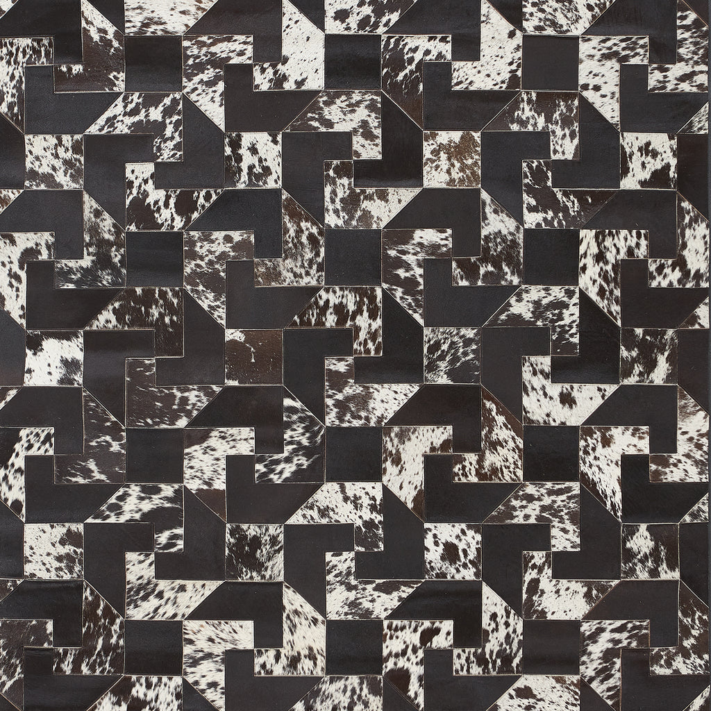 High-contrast geometric cowhide pattern with interlocking L shapes.