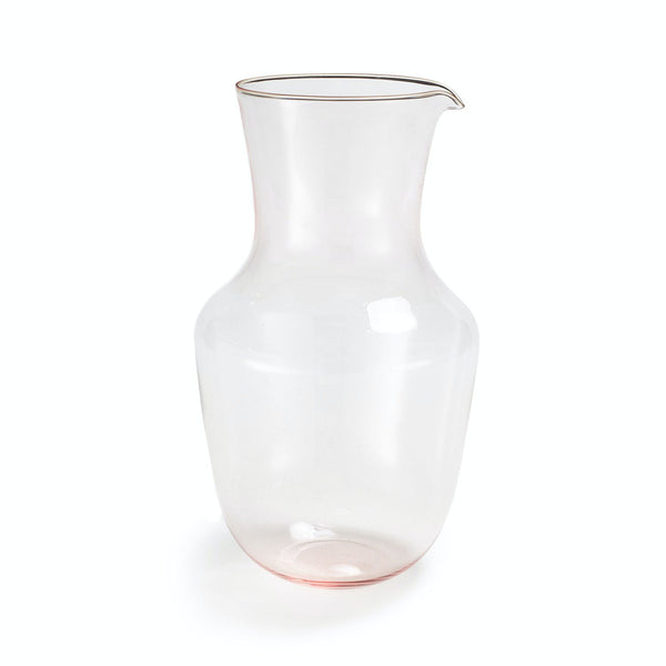 Elegant and functional glass pitcher with slight reddish hue.