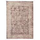 Intricate floral motifs adorn a vintage rectangular area rug.