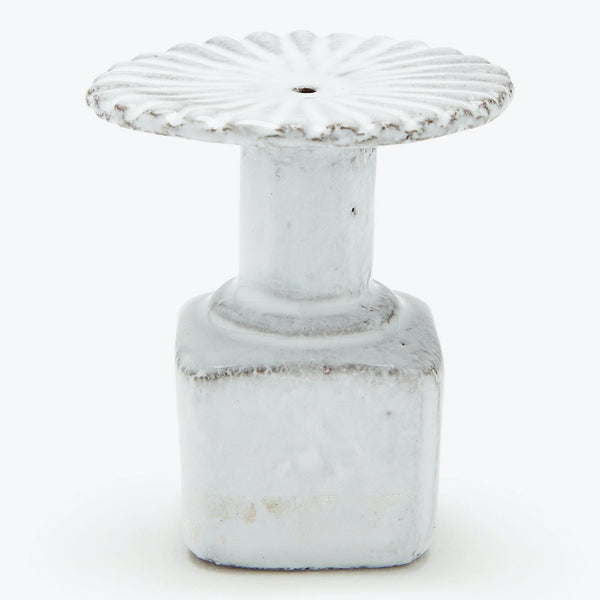Antique ceramic knob with ornate petal design for furniture hardware.