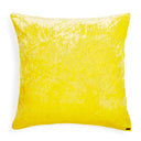 Bright yellow decorative pillow with crinkled texture against white background.