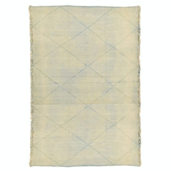 Rectangular rug with subtle diamond pattern and fringed edges