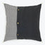 Two-tone square pillow with gingham check pattern and button detailing.