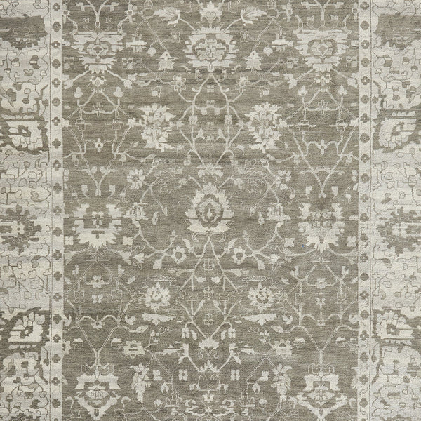 Close-up of a symmetrical, intricate rug with floral and geometric motifs.
