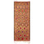 Vibrant handwoven rug showcases intricate diamond pattern and rich colors.