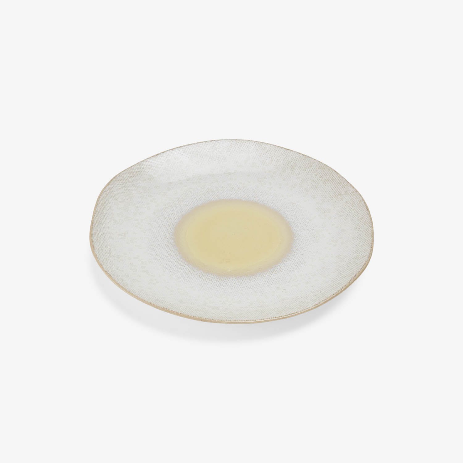 Handcrafted circular plate with textured glaze and distinct food placement area.