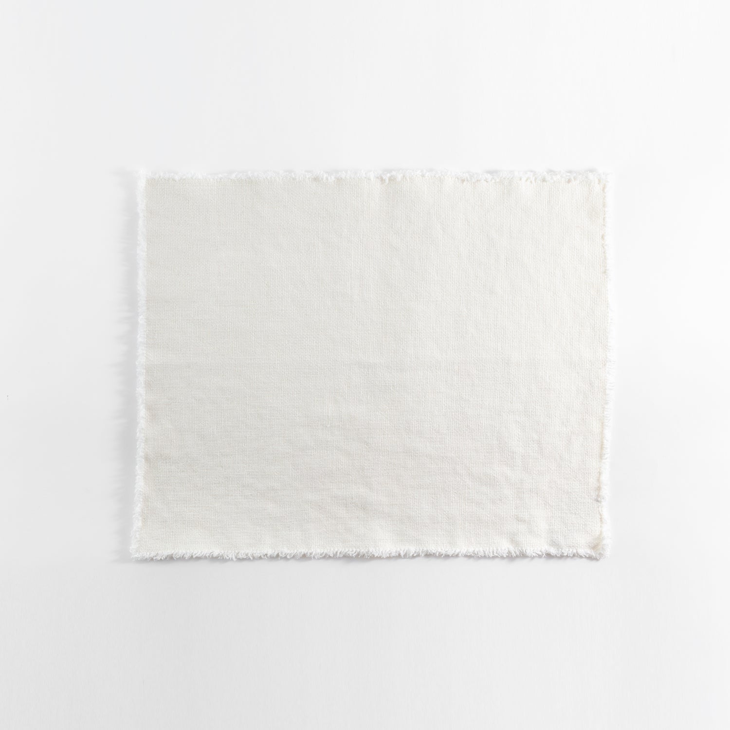 Plain undyed fabric with frayed edges on a white background.