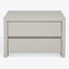 Modern minimalist nightstand in soft neutral tone with seamless drawers.