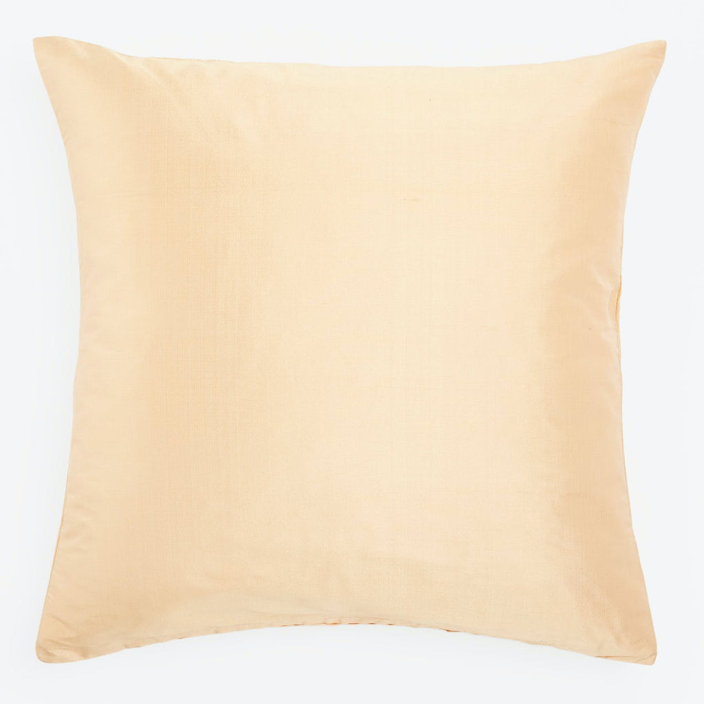 Plain, pale yellow pillow with smooth texture and simple design.