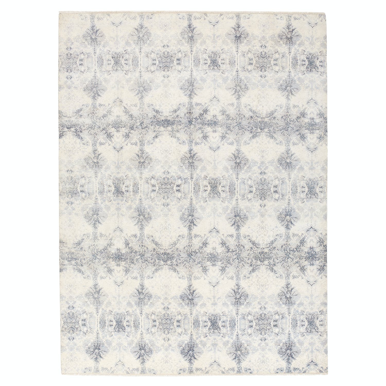 Vintage-inspired rectangular rug with distressed pattern in muted colors.