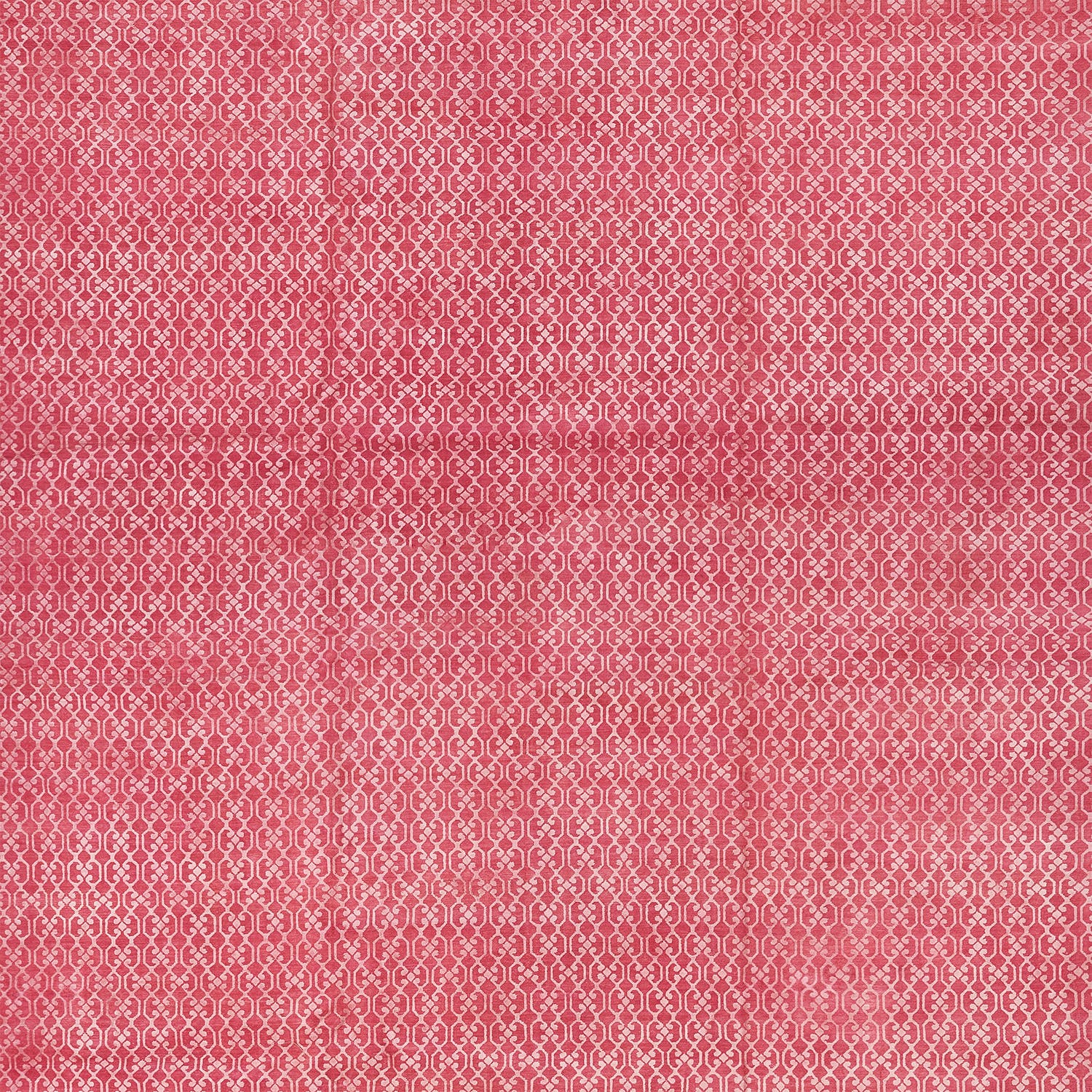 Densely packed lace-like pattern on red background creates ornateness.