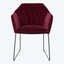 Modern accent chair with rich, burgundy velvet upholstery and sleek metal legs.