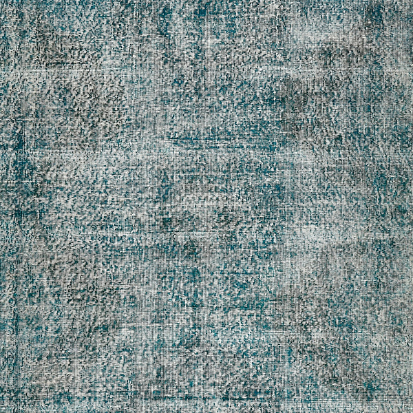 Close-up of distressed fabric resembling vintage weathered upholstery or carpet.
