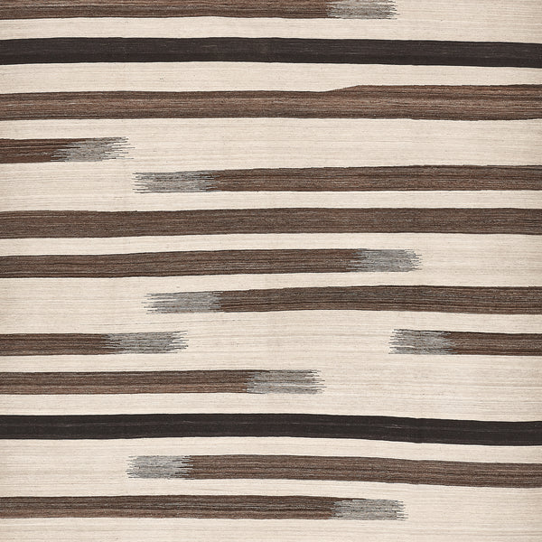 Close-up of textured surface with striped pattern in brown and black.