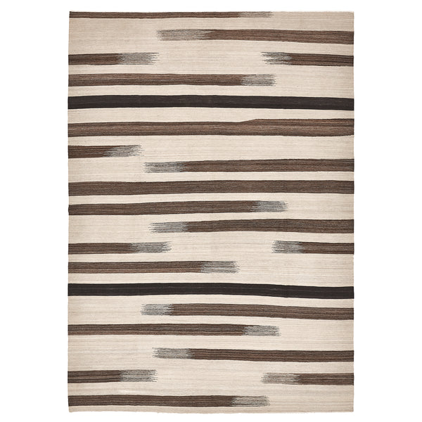 Rectangular rug with organic striped pattern in shades of brown, black, and gray on a light beige background.