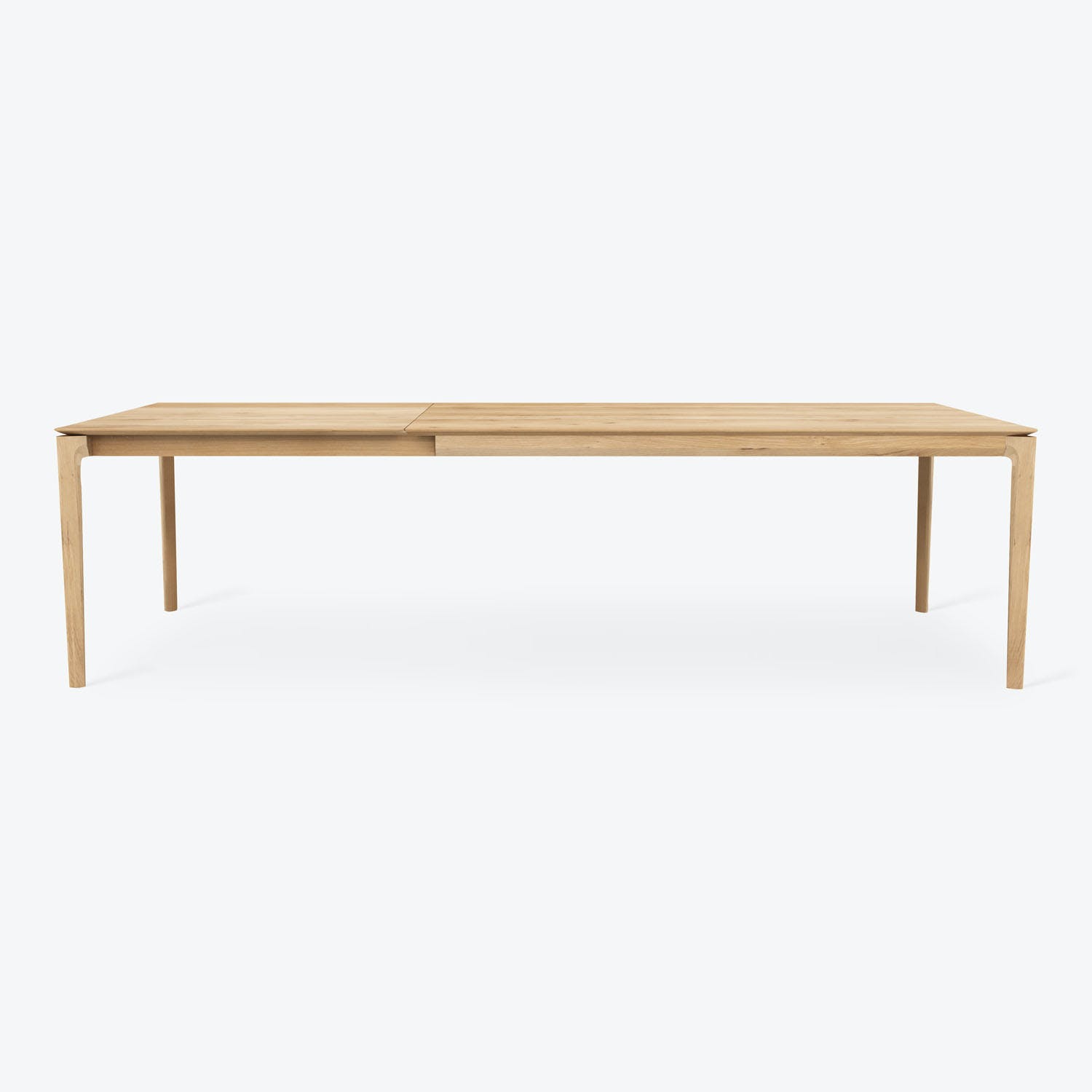 Modern-style dining table with clean lines and light wood finish.