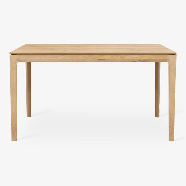 Minimalist wooden table with clean lines and natural grain patterns.