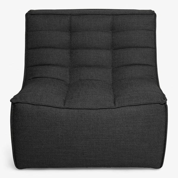 Modern, sleek chair with square tufted backrest and low armrests.
