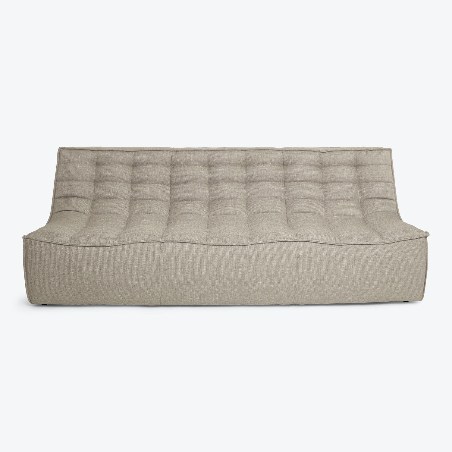 Minimalist modern-style floor couch with tufted upholstery in neutral tone.