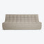 Minimalist modern-style floor couch with tufted upholstery in neutral tone.