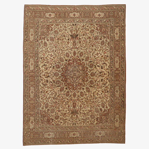 Intricate, handmade rug with floral motifs and geometric patterns.