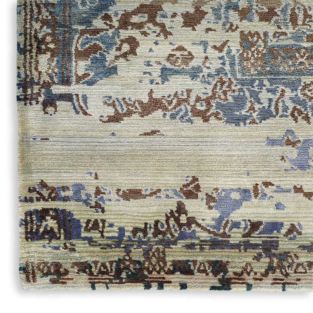 Abstract distressed rug showcasing a blend of blue and brown tones.