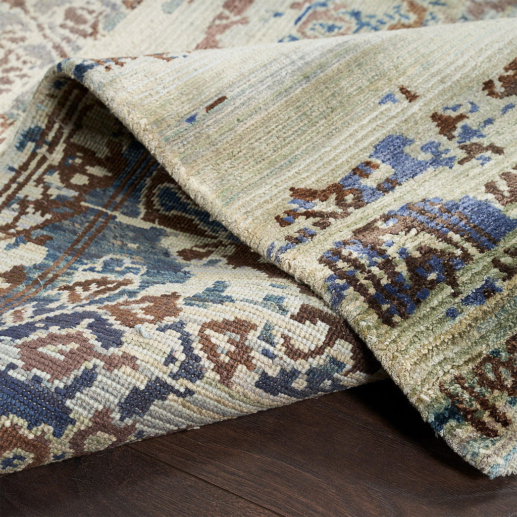 Vibrantly patterned area rug with woven texture adds elegance indoors.