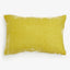 Soft and fluffy yellow pillow adds comfort to any space.
