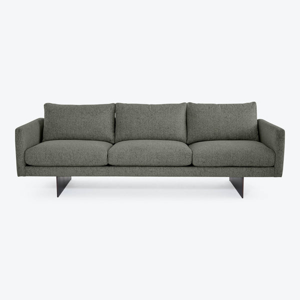 Modern gray sofa with clean lines and minimalist design showcased.