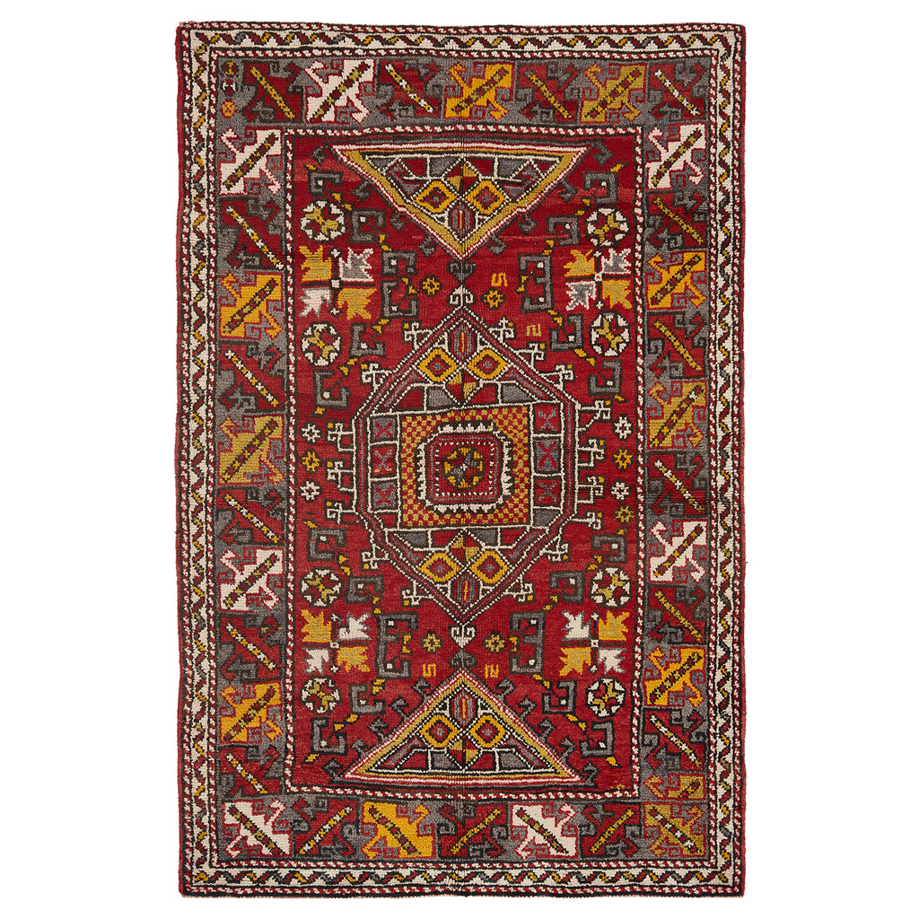 Exquisite hand-woven rug with intricate geometric patterns in rich colors.