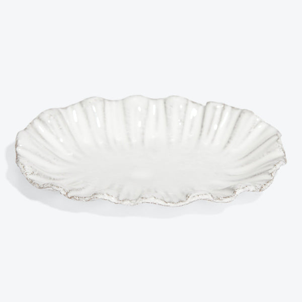 Exquisite ceramic dish with scallop edges mimicking bivalve shell