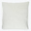 Square pillow with a soft, linen-like fabric cover.