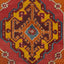 Close-up of a symmetrical and ornate traditional rug design.