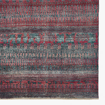 Abstract textured fabric in red and blue with faded look.