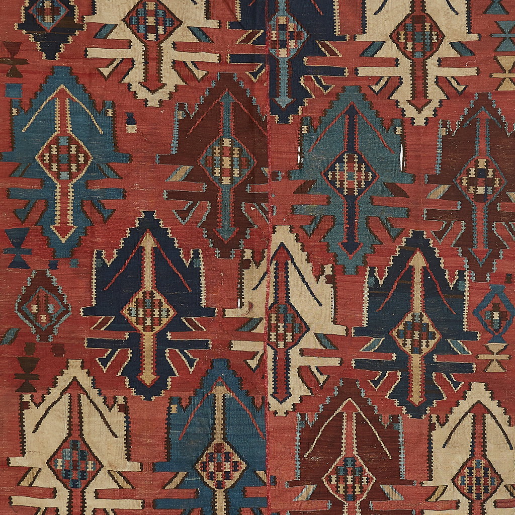 Intricate traditional textile with repeating geometric patterns in vivid colors.