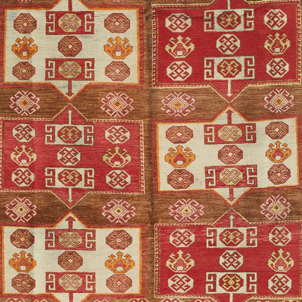 Intricate traditional textile featuring rich colors and symmetrical geometric patterns.
