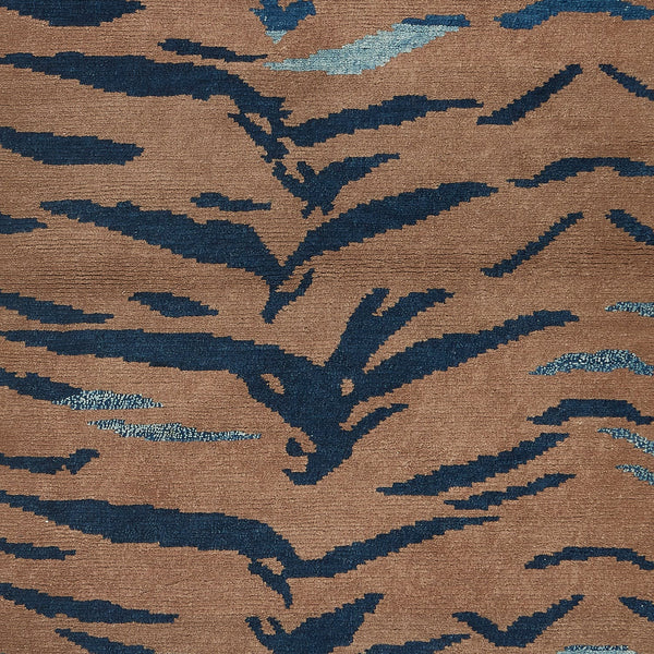 Close-up of a warm brown textile with abstract blue patterns