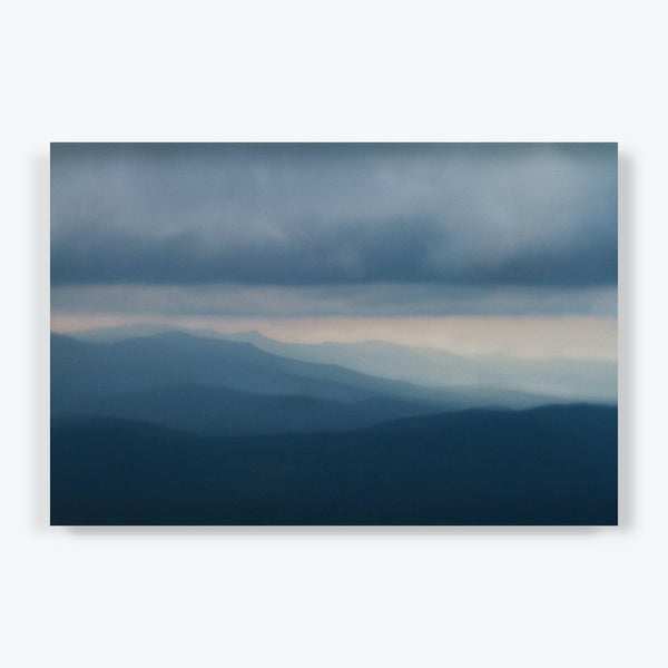 Hazy mountains recede into the distance, creating a serene landscape.