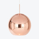 Sleek copper pendant lamp with modern design and illuminated glow.