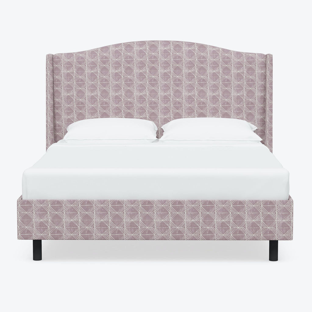 Modern bed with geometric patterned upholstery and clean minimalist design.