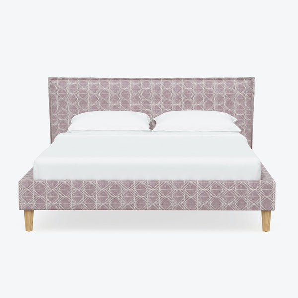 Contemporary bed with purple patterned upholstery and wooden tapered legs.