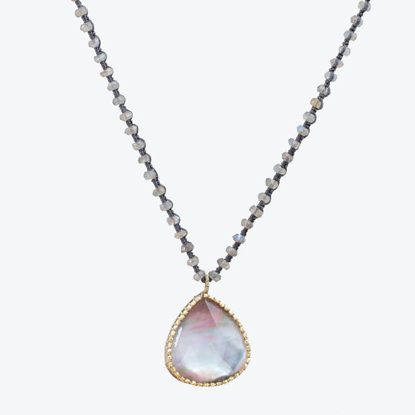 Elegant necklace with iridescent pendant, perfect for formal occasions.
