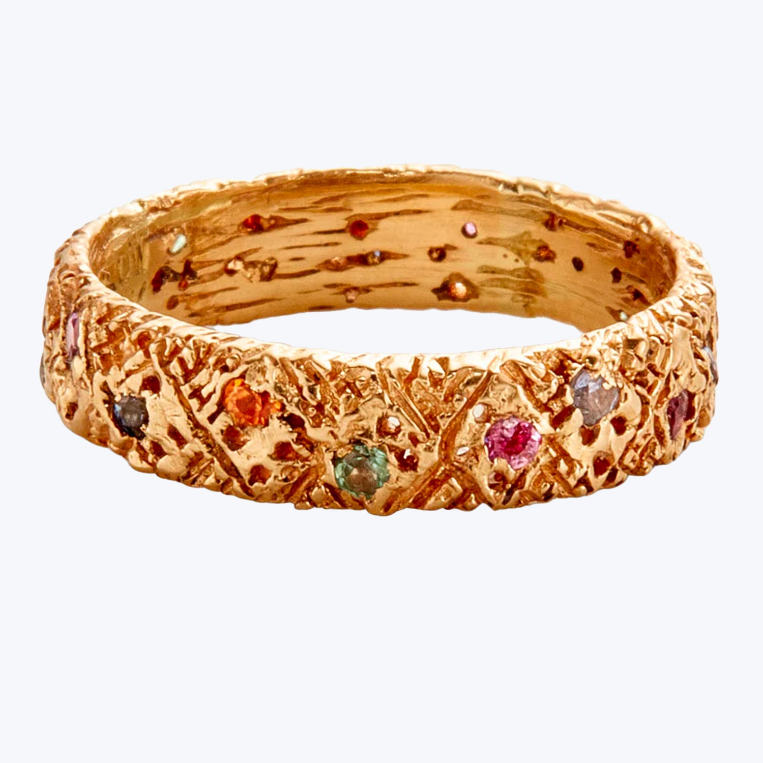Elegant golden bracelet with textured surface and playful gemstones