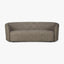 Modern curved sofa with neutral upholstery and minimalist silhouette.