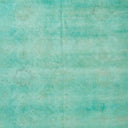 Vintage teal wallpaper with faded floral motifs and distressed texture.