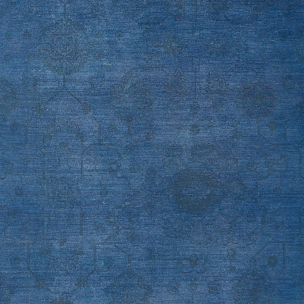 Abstract textured surface showcasing a vintage blue canvas with wear.