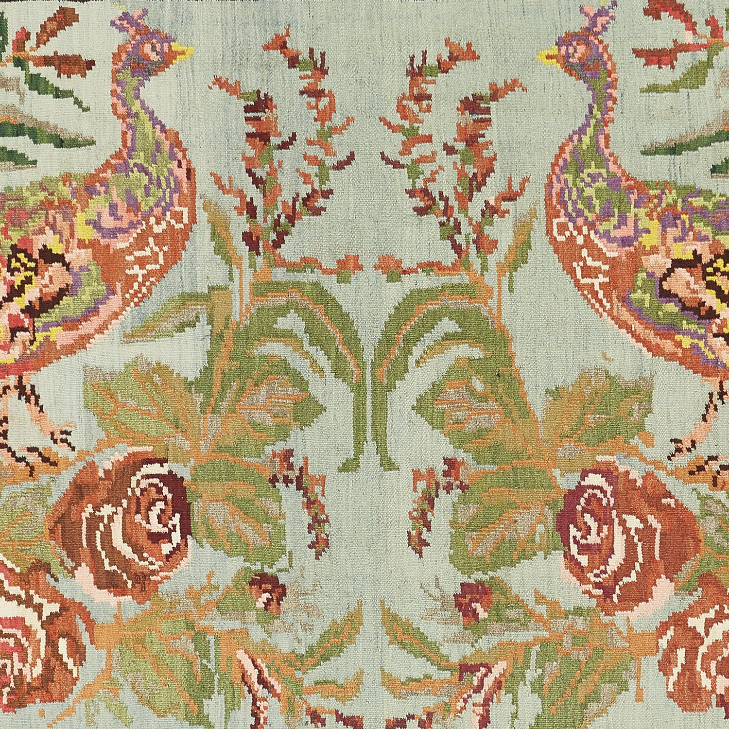 Intricate textile design showcasing stylized birds and floral motifs.