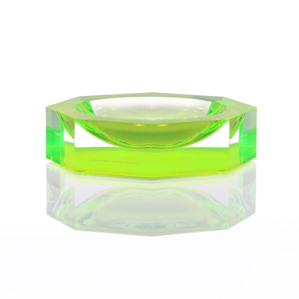 Striking neon green acrylic bowl with sleek design and reflective surface.